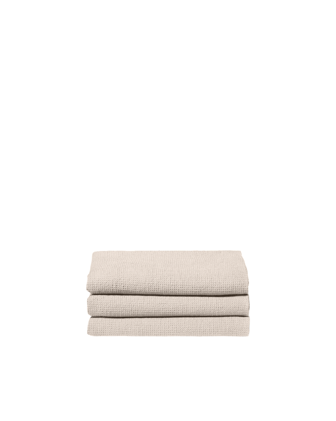 Serviette de bain Merci Paris en lin nid d'abeille couleur pierre pliée en pile sur fond noir
