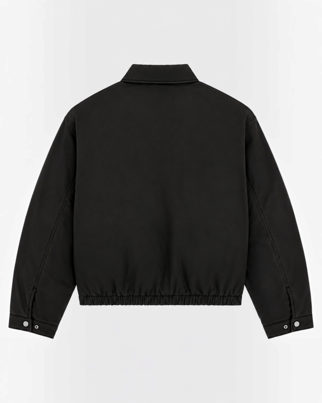 Back view of the black cotton Eisenhower jacket from Merci Paris, workwear style with elasticated hem.