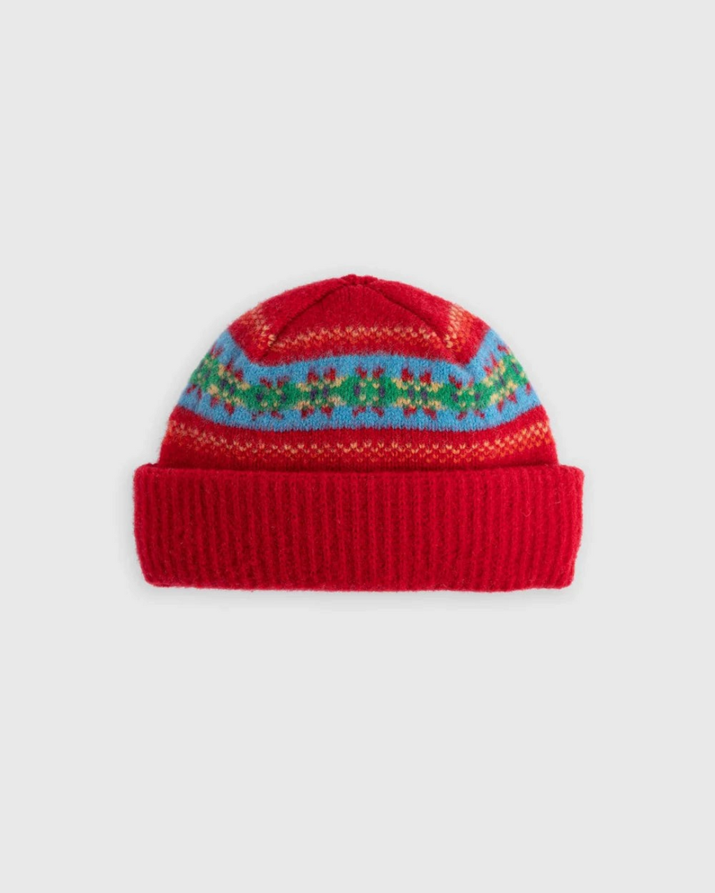 Bonnet Merci Paris Howlin' en laine d'agneau rouge avec motifs graphiques colorés et revers en maille côtelée