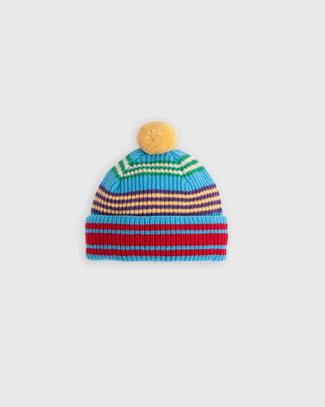 Bonnet Merci Paris Howlin' en laine d'agneau bleue à rayures multicolores avec pompon jaune sur le dessus