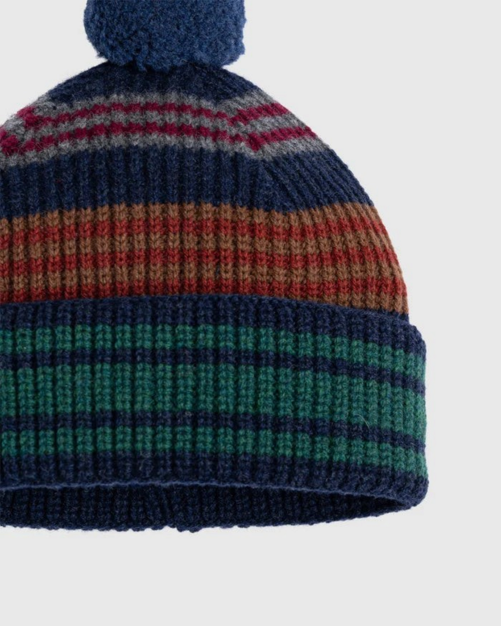 Bonnet Merci Paris Howlin' en laine d'agneau mérinos marine à rayures multicolores avec pompon et maille brossée