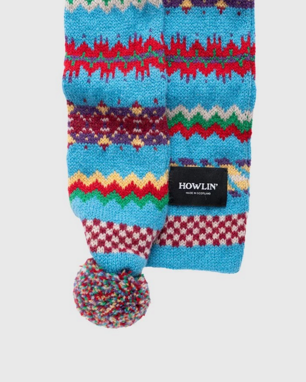 Écharpe Merci Paris Howlin' Small Woolen Wonder bleue en laine d'agneau avec motif Fair Isle et pompon multicolore