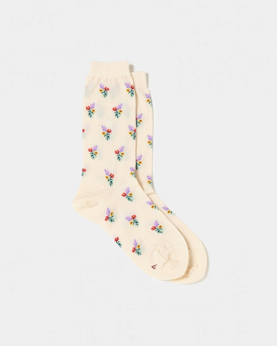 Chaussettes Merci Paris Babaco en maille écru avec motif de petits bouquets de fleurs colorés, fabriquées au Japon