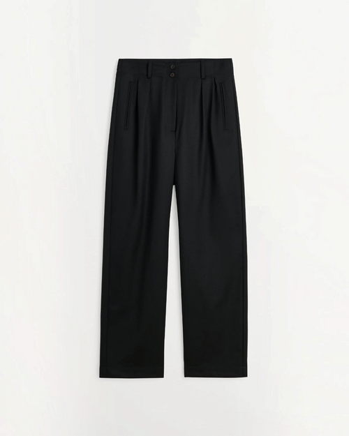 Wool black wide-leg pants Skall Studio with semi-high waist and pleats, available at Merci Paris