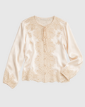 Blouse Lucine Merci Paris en satin de soie écru avec détails en dentelle délicate et fermeture à liens