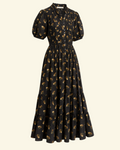 Robe midi Merci Paris Dôen Haleigh noire à fleurs, col montant volanté, manches bouffantes et jupe à volants étagés.