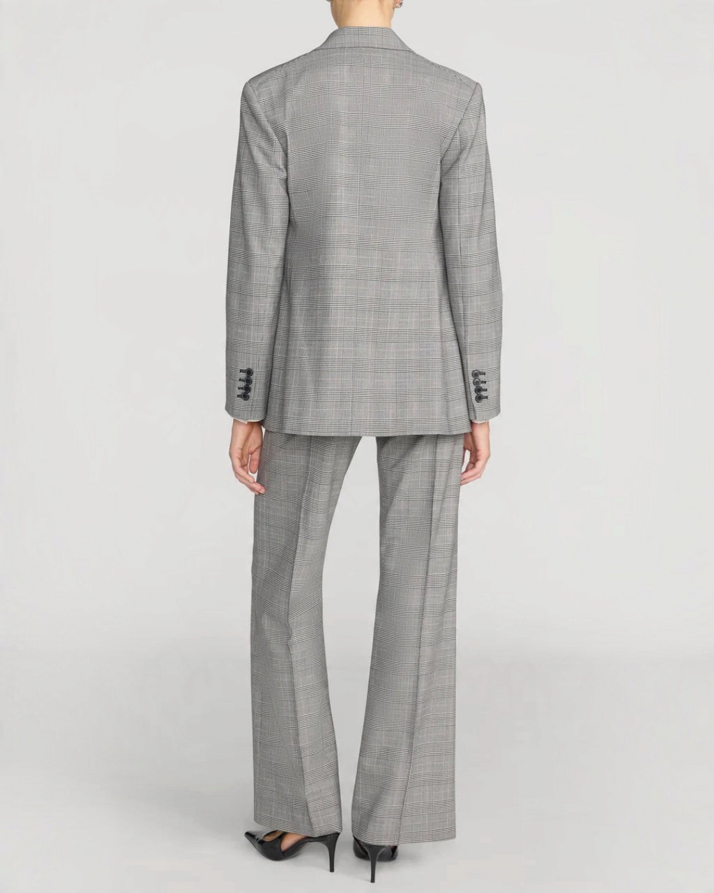 Vue arrière du tailleur Merci Paris Frame composé d'un blazer et d'un pantalon à motif plaid noir et gris