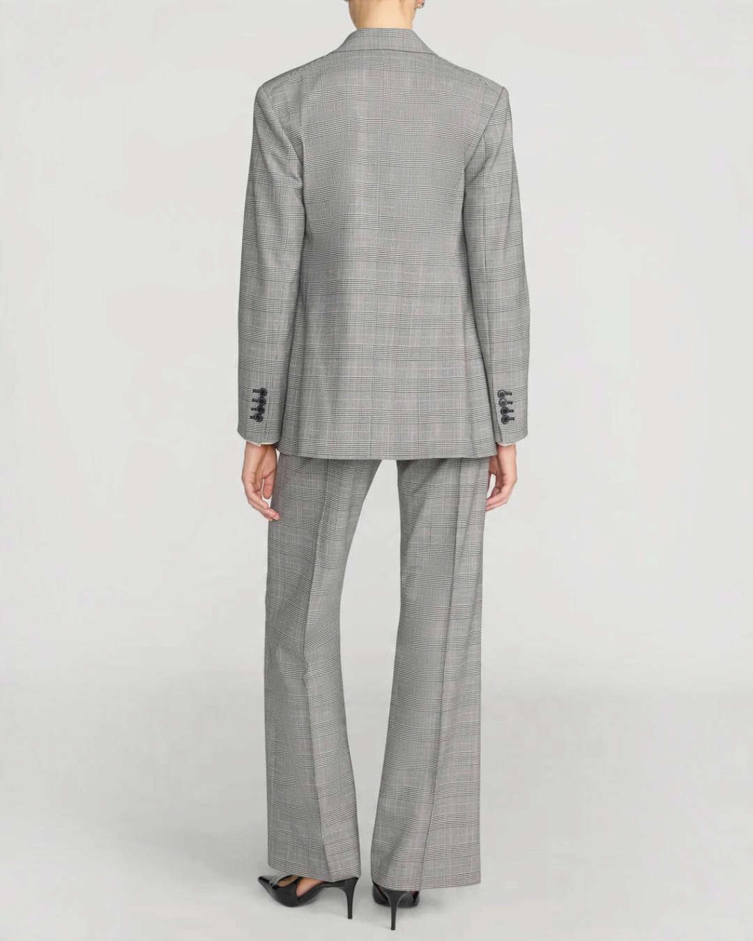 Vue arrière du tailleur Merci Paris Frame composé d'un blazer et d'un pantalon à motif plaid noir et gris