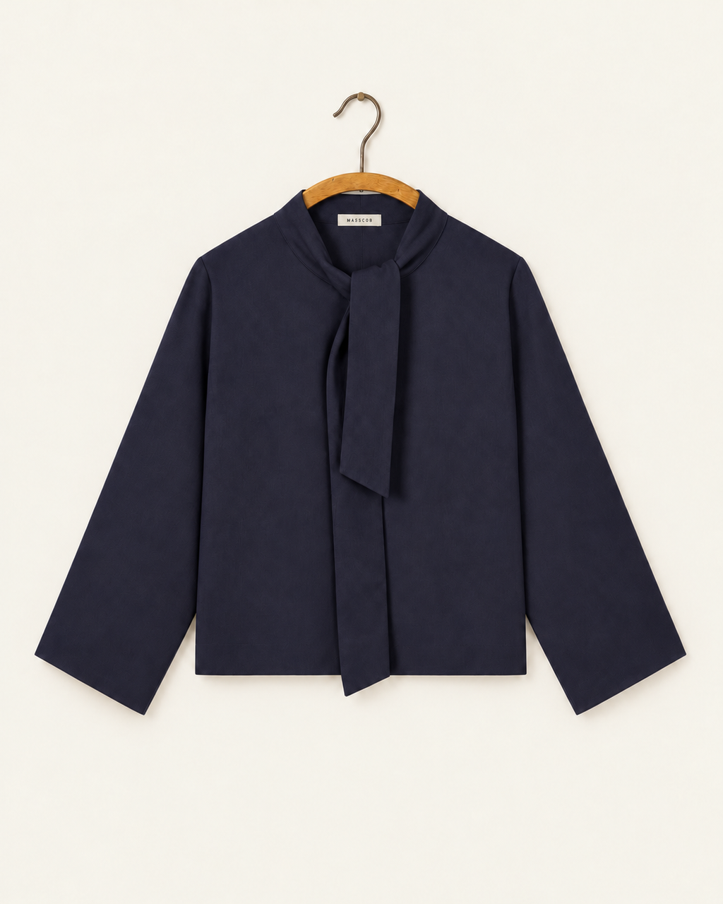 Masscob - Milena navy top on wooden hanger with label Masscob