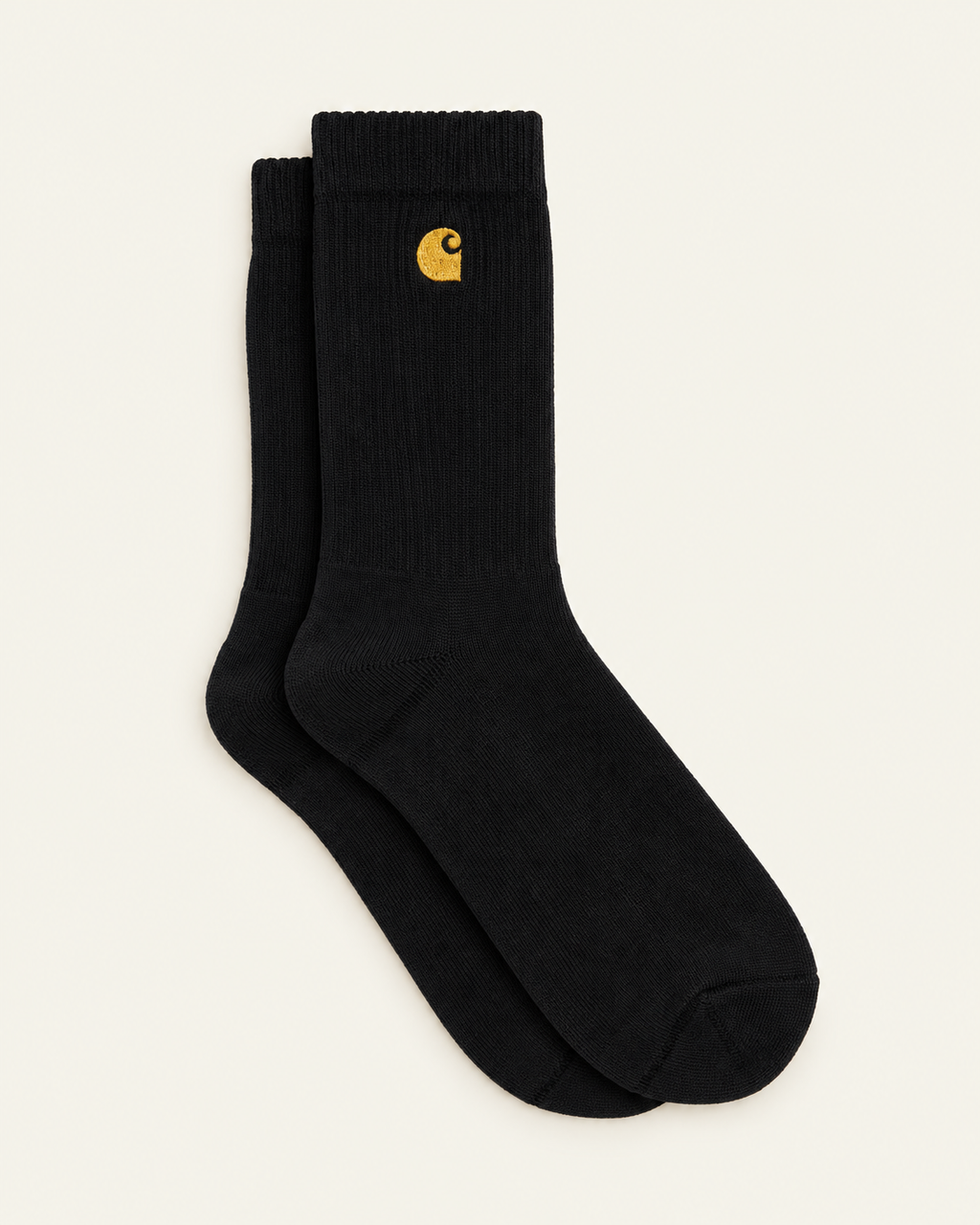 Carhartt Wip - Chaussettes Chase - Noir & Doré — paire en packshot sur fond écru